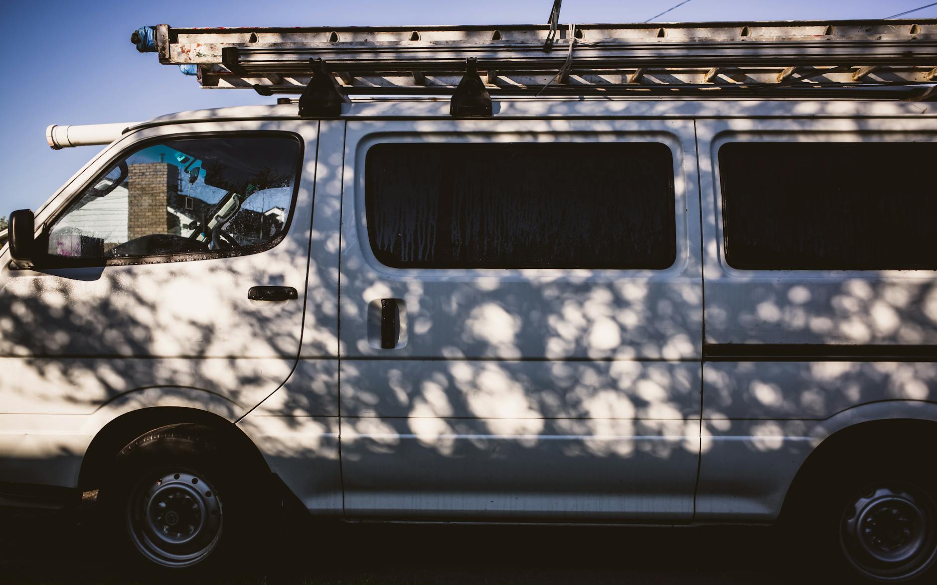 a ladder on a white van