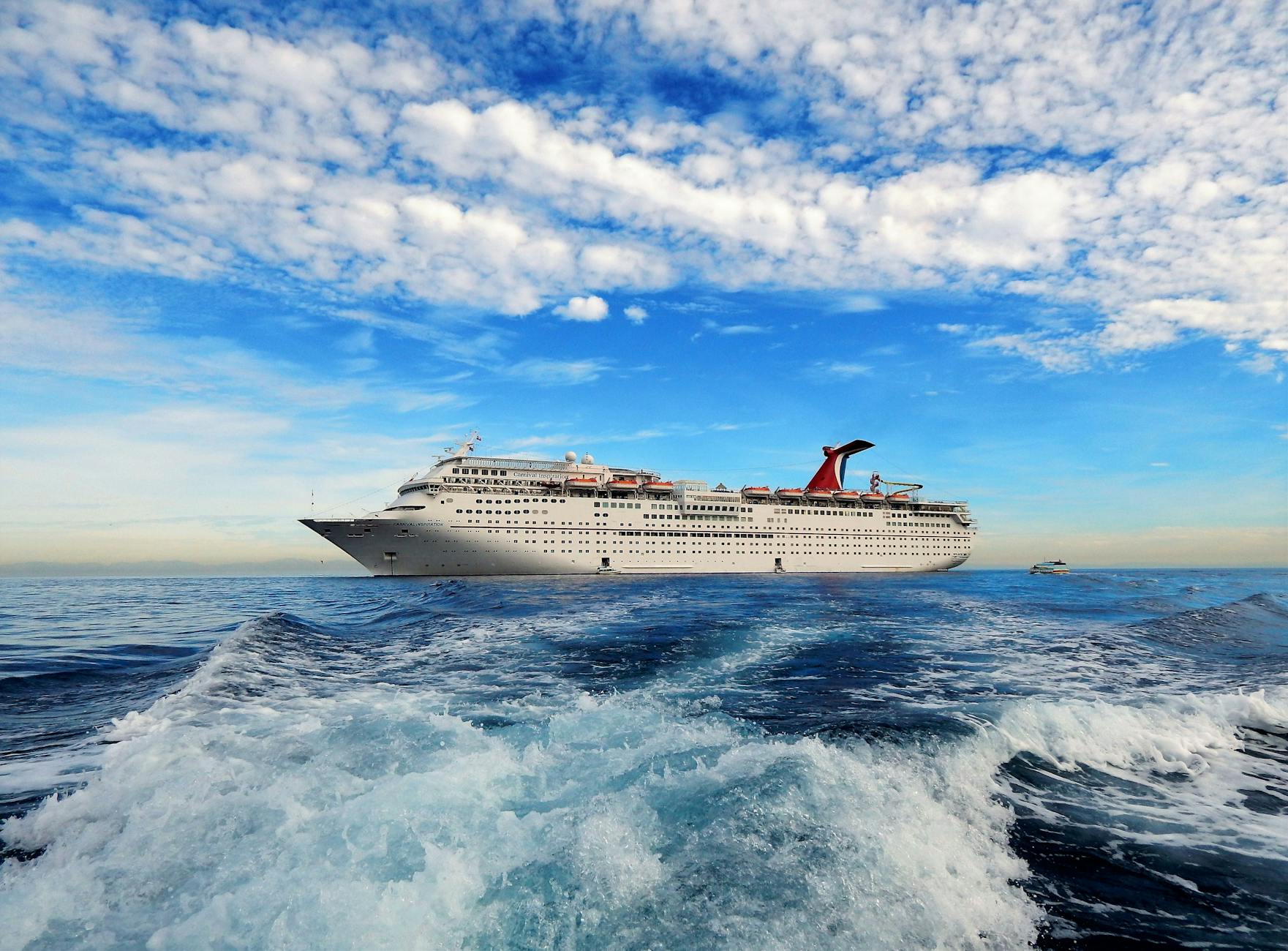 white cruise ship anchored on sea